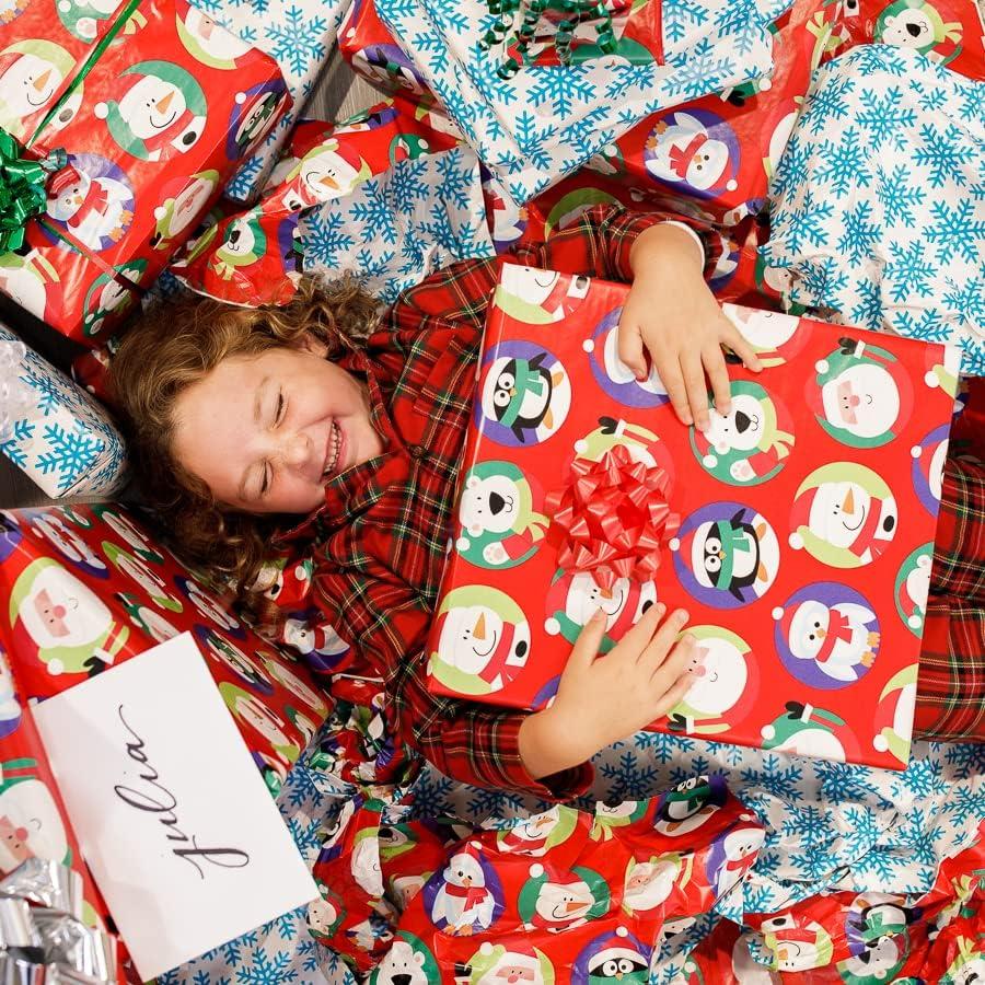 imageAmerican Greetings Jumbo Kids Christmas Reversible Wrapping Paper Roll Red and Blue Holiday Gift Wrap 175 sq ft 1 Extra Large Roll30 in x 70 ft Penguins Polar Bears Santa SnowflakesSanta and Snowflakes